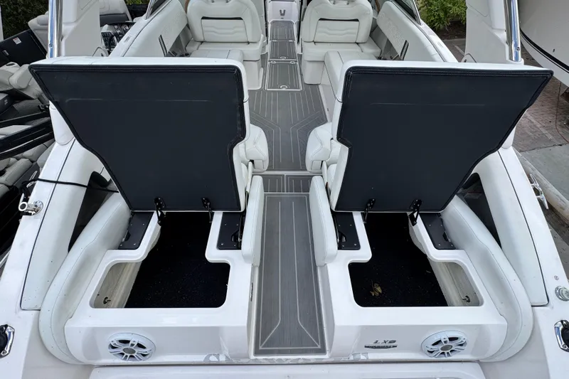  Yacht Photos Pics 2024 Regal LX9 boat interior with open storage compartments and seating.