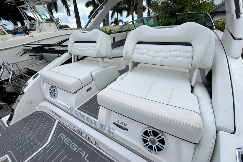  Yacht Photos Pics 2024 Regal LX9 boat with white seating, speakers, and sleek design in Longboat Key, FL.