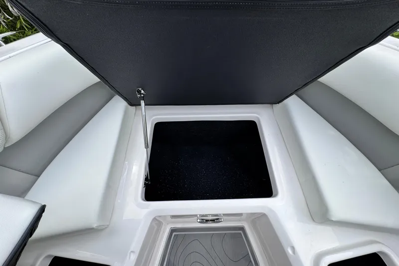  Yacht Photos Pics 2024 Regal LX9 boat storage compartment with open lid, showcasing spacious interior.