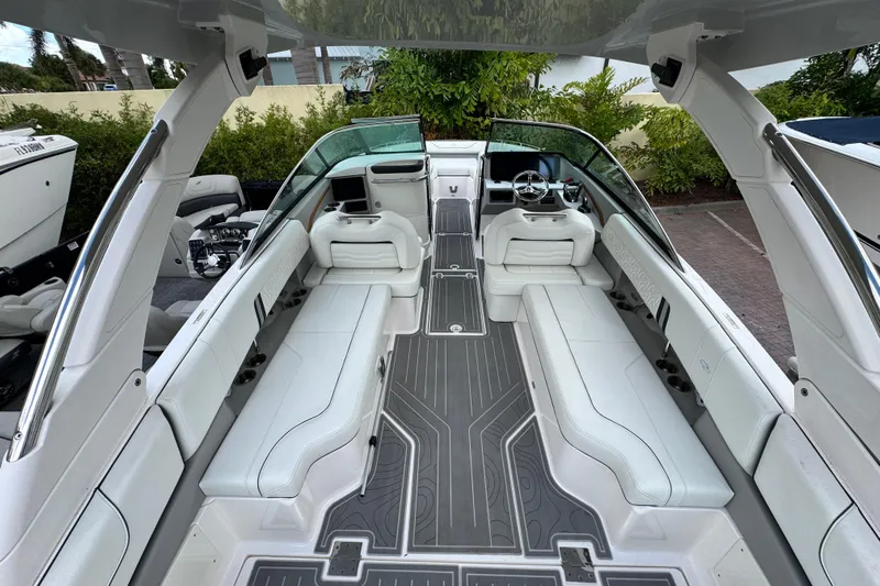  Yacht Photos Pics 2024 Regal LX9 boat interior with sleek white seating and modern dashboard design.