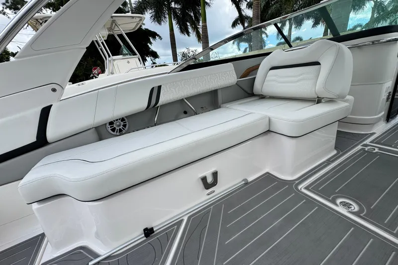  Yacht Photos Pics 2024 Regal LX9 boat interior with white seating and sleek design.