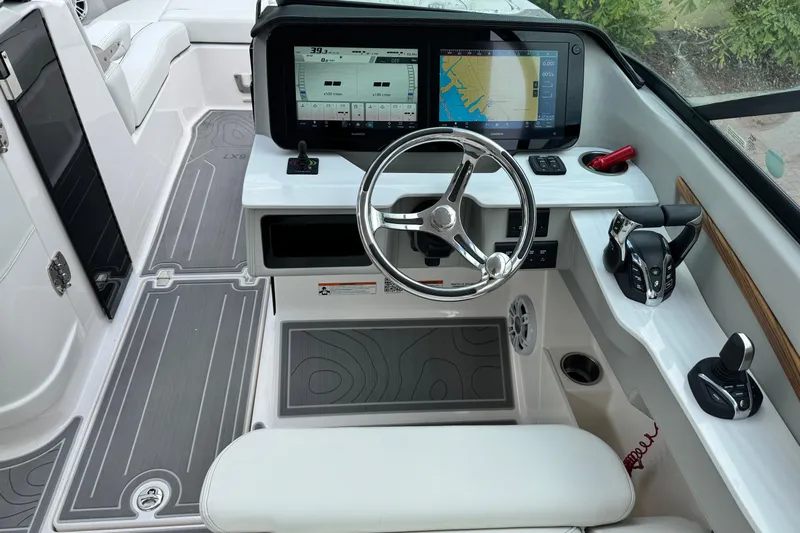  Yacht Photos Pics 2024 Regal LX9 boat cockpit with modern steering, dual displays, and control panel.