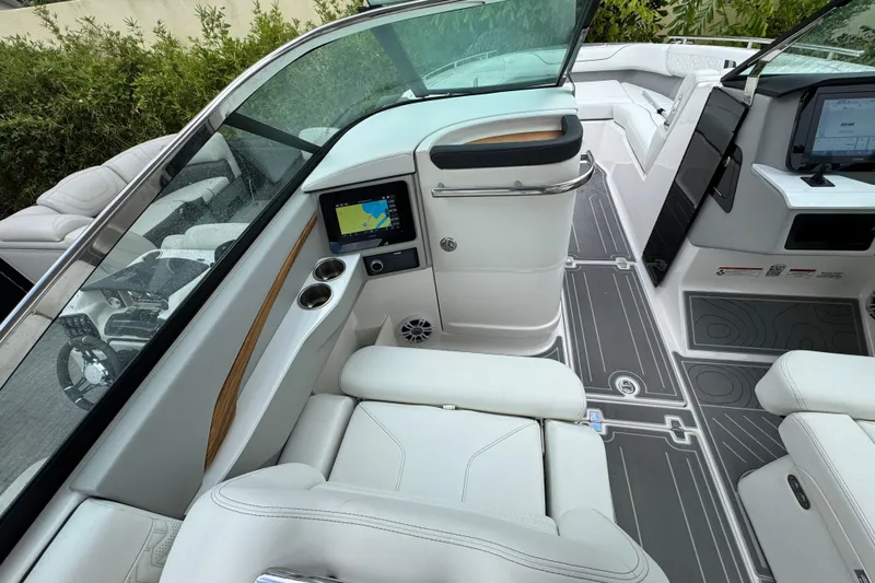  Yacht Photos Pics 2024 Regal LX9 boat interior with white seating, navigation screen, and modern dashboard.