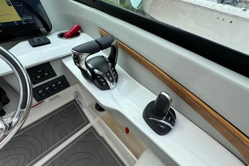 Yacht Photos Pics 2024 Regal LX9 boat cockpit with modern controls and steering wheel, featuring sleek design elements.
