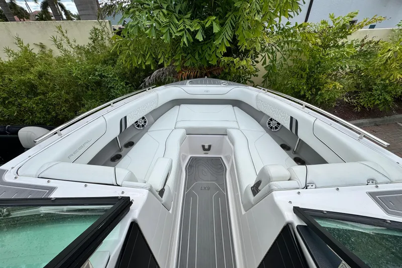  Yacht Photos Pics 2024 Regal LX9 boat interior with white seating and modern design.