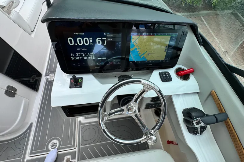  Yacht Photos Pics 2024 Regal LX9 boat dashboard with GPS navigation and steering wheel.