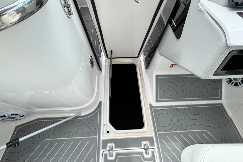  Yacht Photos Pics 2024 Regal LX9 boat interior with open hatch and stylish flooring.