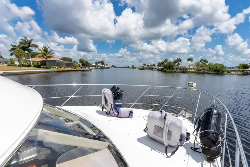  Yacht Photos Pics 2005 Carver 390 MY yacht cruising on a sunny day with scenic waterfront views.