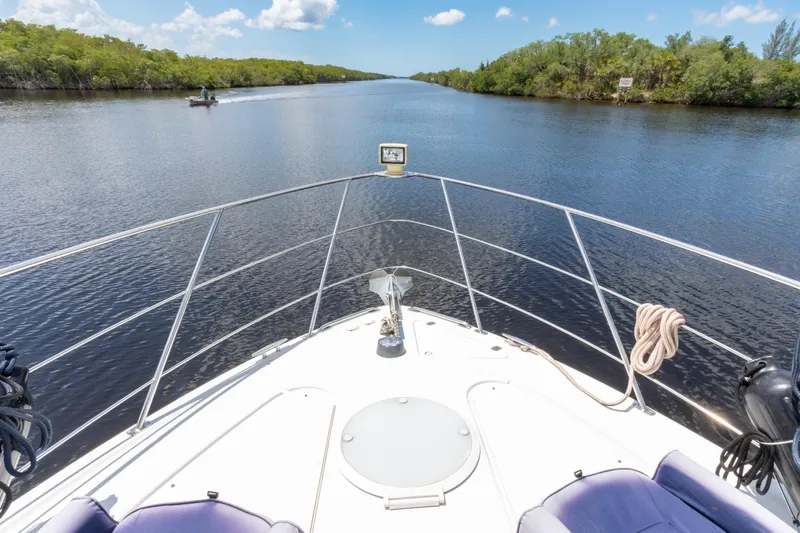  Yacht Photos Pics Bow view from 2005 Carver 390 MY yacht cruising through a serene river.
