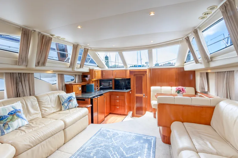  Yacht Photos Pics Luxurious interior of 2005 Carver 390 MY yacht with leather seating and panoramic windows.