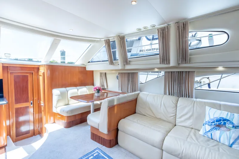  Yacht Photos Pics Luxurious interior of 2005 Carver 390 MY yacht with plush seating and dining area.