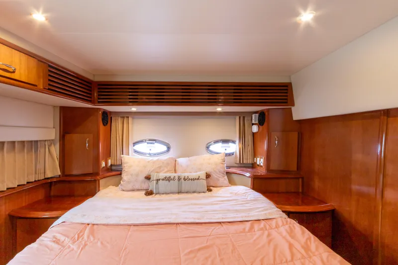  Yacht Photos Pics Luxurious bedroom interior of 2005 Carver 390 MY yacht with cozy bedding.