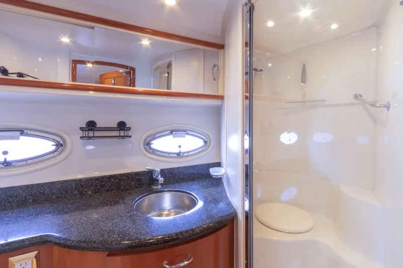  Yacht Photos Pics Luxurious bathroom in 2005 Carver 390 MY yacht with granite countertop and modern fixtures.