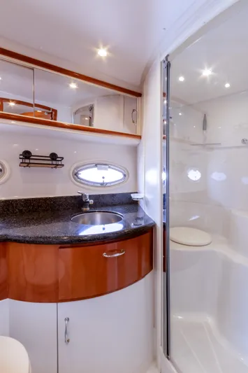  Yacht Photos Pics Luxurious bathroom in 2005 Carver 390 MY yacht with modern fixtures and elegant design.