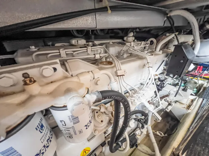  Yacht Photos Pics Engine compartment of a 2005 Carver 390 MY yacht, showcasing detailed mechanical components.