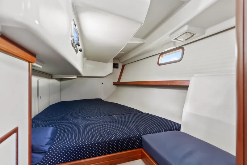 Resolute Yacht Photos Pics Cozy cabin interior of 2015 Blue Jacket 40 sailboat with polka dot bedding.