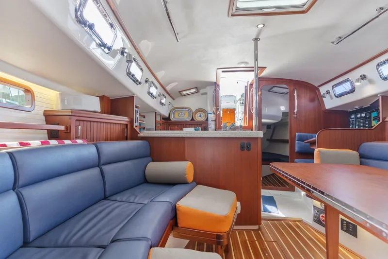 Resolute Yacht Photos Pics Luxurious interior of 2015 Blue Jacket 40 sailboat with modern furnishings and wood accents.