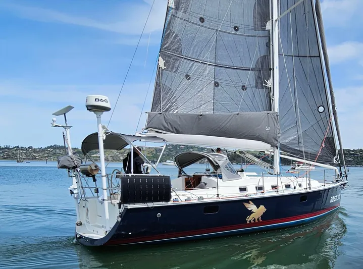 Resolute Yacht Photos Pics Sailing yacht Blue Jacket 40, 2015 model, on calm waters with clear skies.