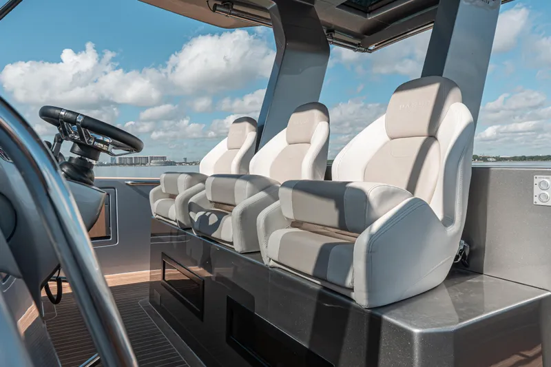 Live A Little Yacht Photos Pics Luxury seating on 2021 Pardo Yachts 43, featuring modern helm design and ocean view.