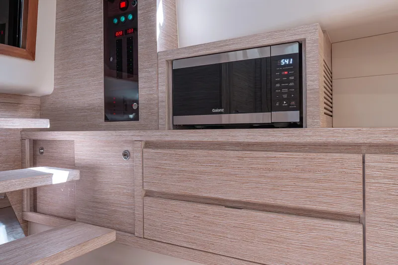 Live A Little Yacht Photos Pics Modern kitchen interior of 2021 Pardo Yachts 43, featuring a built-in microwave.