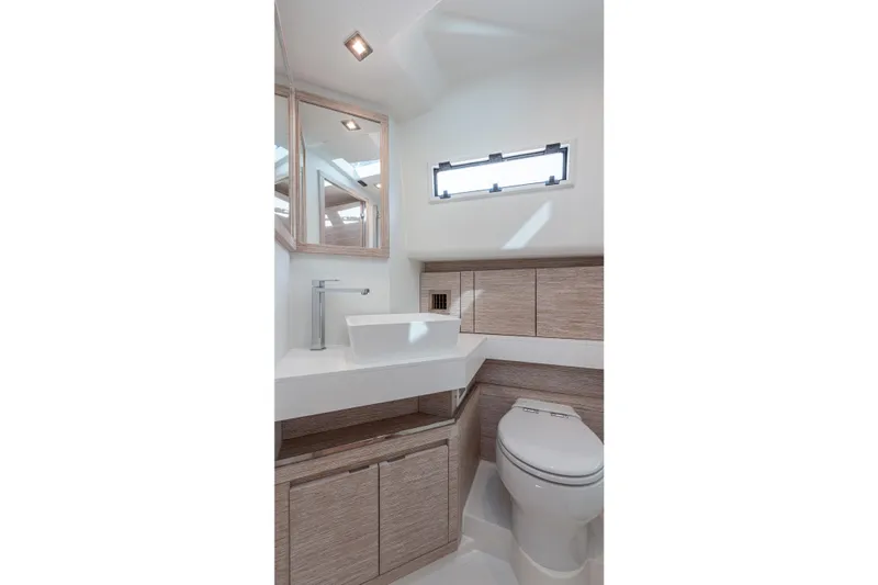 Live A Little Yacht Photos Pics Modern bathroom interior on 2021 Pardo Yachts 43, featuring sleek sink and toilet design.