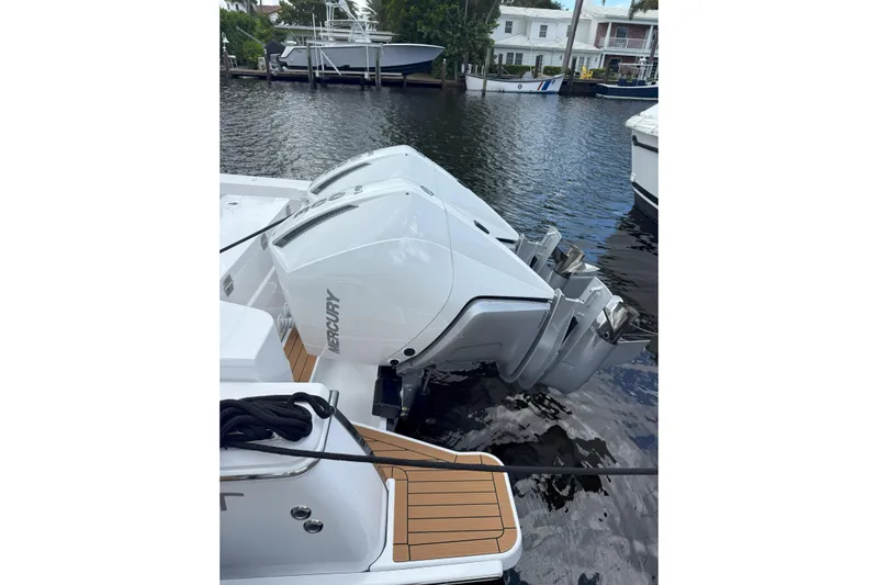 Yacht Photos Pics 2026 Southport 30 FE boat with dual Mercury outboard engines docked by the water.
