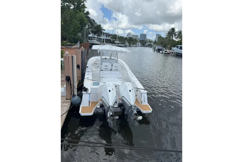  Yacht Photos Pics 2026 Southport 30 FE boat docked on a calm waterfront.