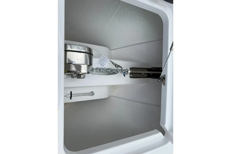  Yacht Photos Pics Anchor storage compartment of 2026 Southport 30 FE boat, featuring chain and winch.