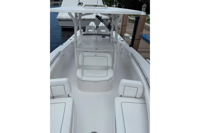  Yacht Photos Pics 2026 Southport 30 FE boat interior with white seating and helm station.