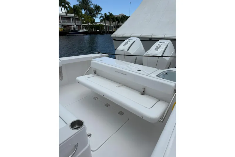  Yacht Photos Pics 2026 Southport 30 FE boat with dual Mercury engines, docked by waterfront homes.