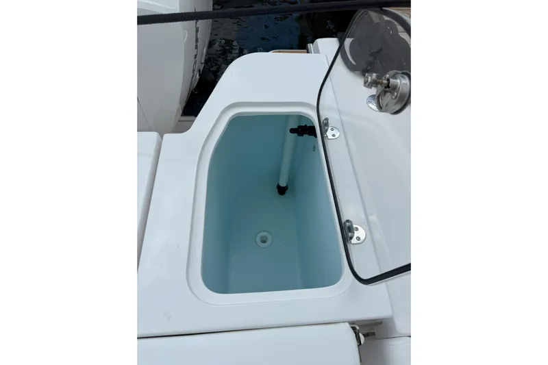  Yacht Photos Pics Livewell compartment on 2026 Southport 30 FE boat, featuring a sleek design.