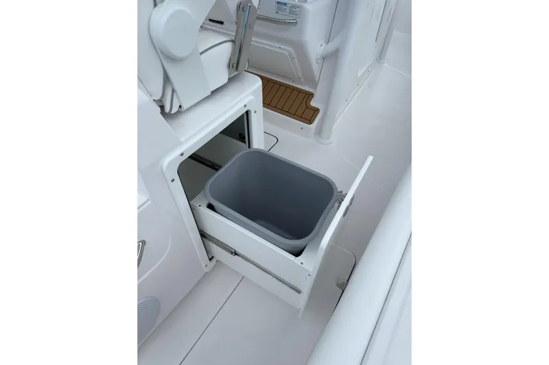  Yacht Photos Pics 2026 Southport 30 FE boat with built-in storage compartment and trash bin.