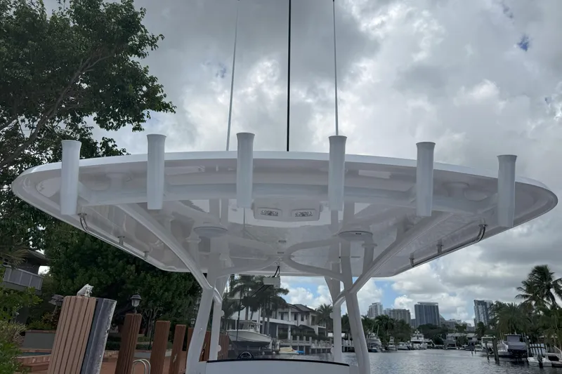  Yacht Photos Pics 2026 Southport 30 FE boat with rod holders, docked under cloudy sky.