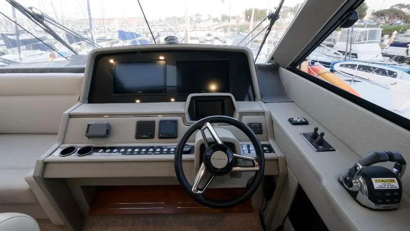  Yacht Photos Pics 2020 Maritimo M51 yacht helm with modern controls and navigation screens.