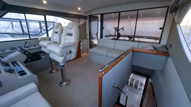  Yacht Photos Pics Luxurious interior of 2020 Maritimo M51 yacht with plush seating and modern helm.