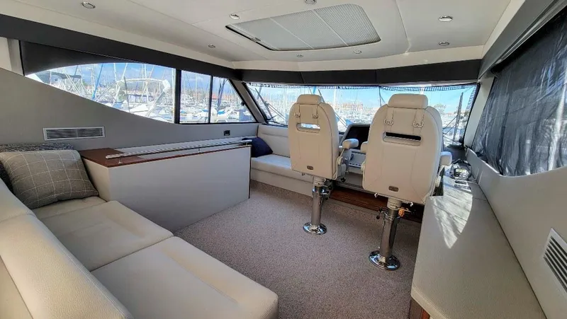  Yacht Photos Pics Luxurious interior of 2020 Maritimo M51 yacht with plush seating and helm chairs.