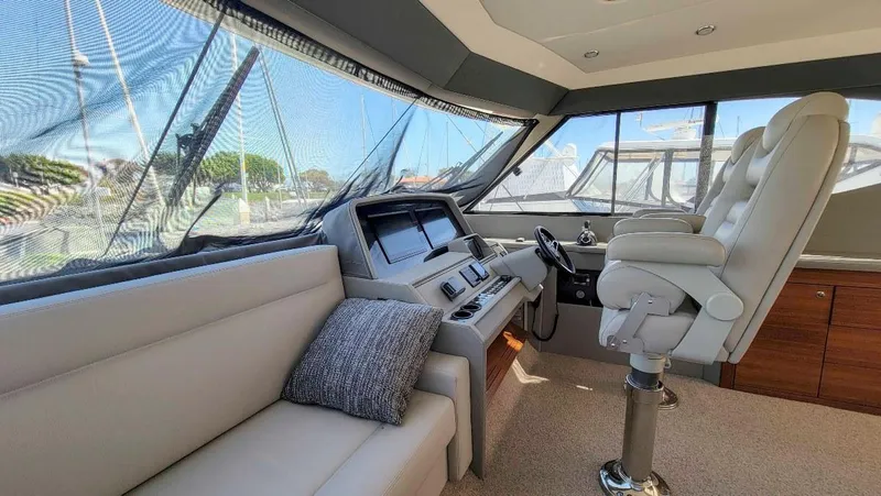  Yacht Photos Pics 2020 Maritimo M51 yacht interior with helm, plush seating, and modern dashboard.