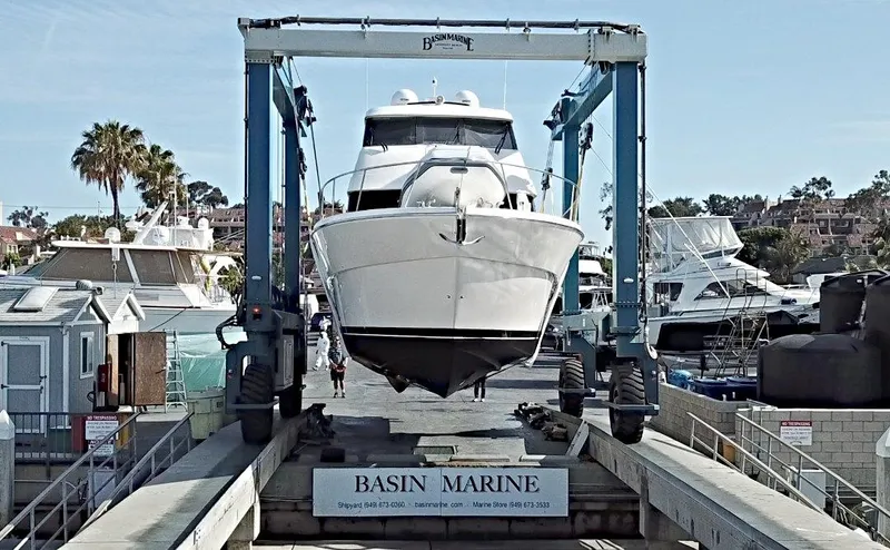  Yacht Photos Pics 2020 Maritimo M51 yacht at Basin Marine, lifted by a boat hoist.