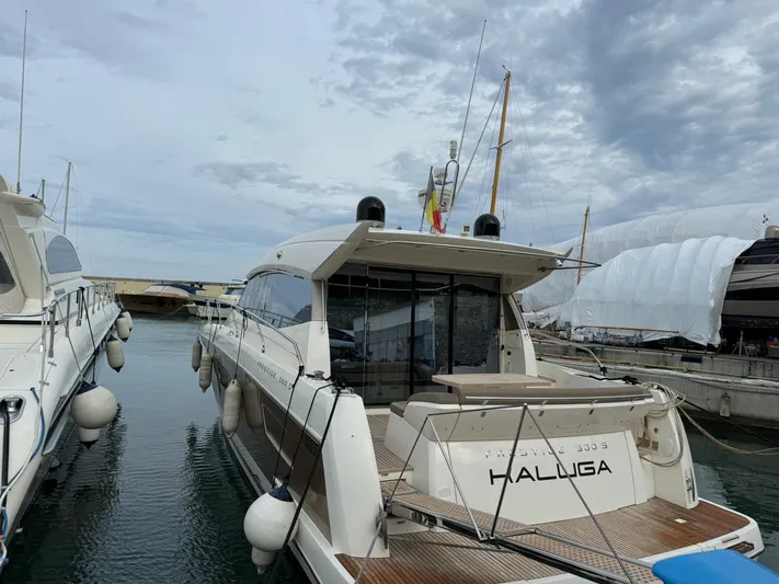  Yacht Photos Pics Luxury 2011 Prestige 500 S yacht docked in marina under cloudy sky.