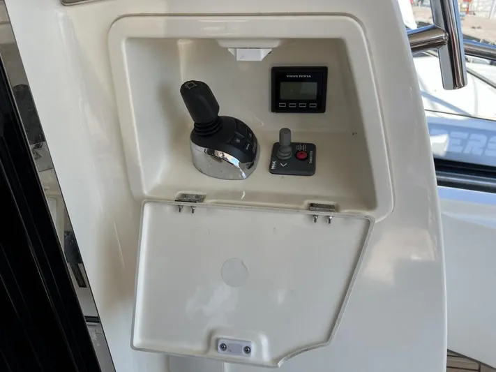  Yacht Photos Pics Control panel of a 2011 Prestige 500 S yacht with joystick and display.