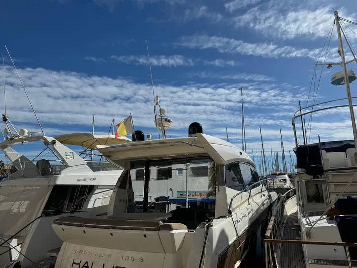  Yacht Photos Pics Prestige 500 S yacht from 2011 docked at marina under blue sky.