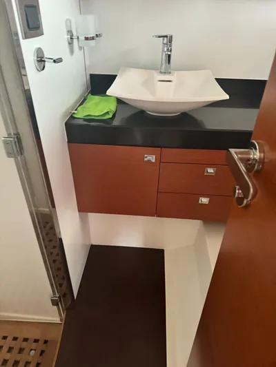  Yacht Photos Pics Bathroom interior of 2011 Prestige 500 S yacht with modern sink and wooden cabinetry.
