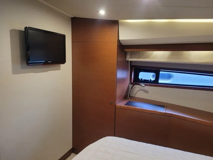  Yacht Photos Pics Interior of 2011 Prestige 500 S yacht cabin with TV and window.
