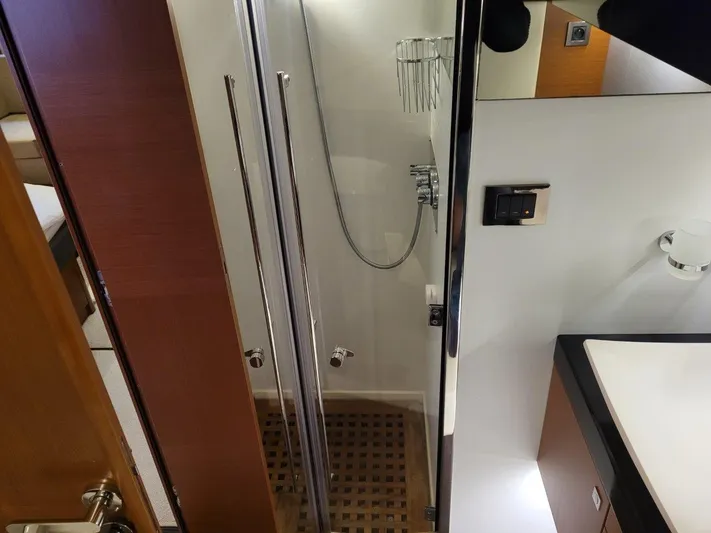  Yacht Photos Pics Luxurious bathroom interior of 2011 Prestige 500 S yacht with modern shower and sink.