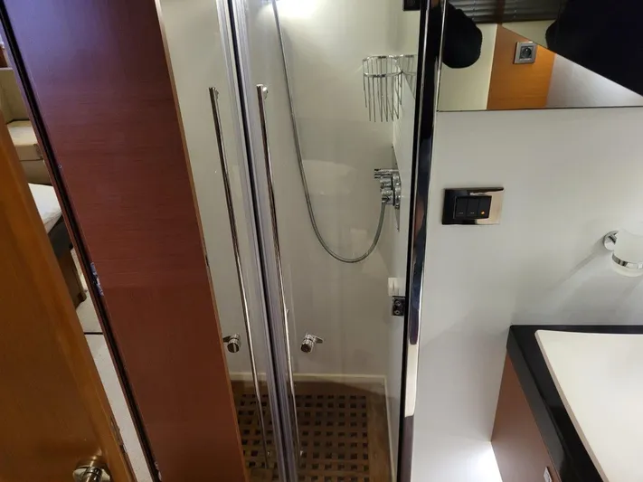  Yacht Photos Pics Shower area in 2011 Prestige 500 S yacht with modern fixtures and wooden flooring.