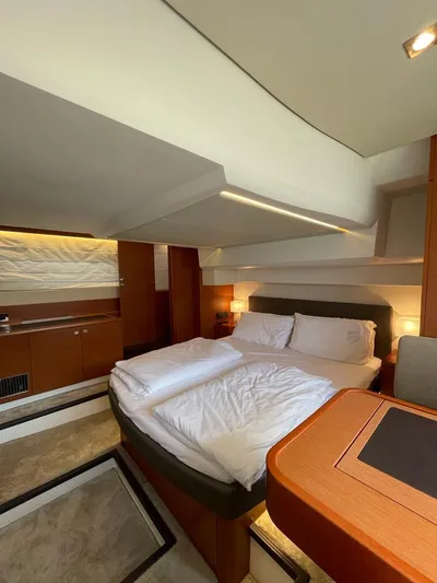  Yacht Photos Pics Luxurious cabin interior of 2011 Prestige 500 S yacht with cozy bedding.