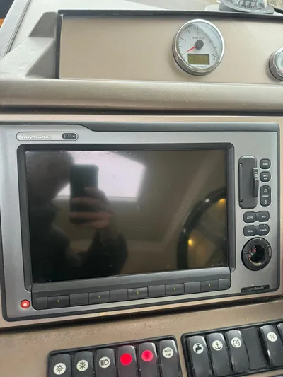  Yacht Photos Pics Control panel of a 2011 Prestige 500 S yacht with navigation display and gauges.