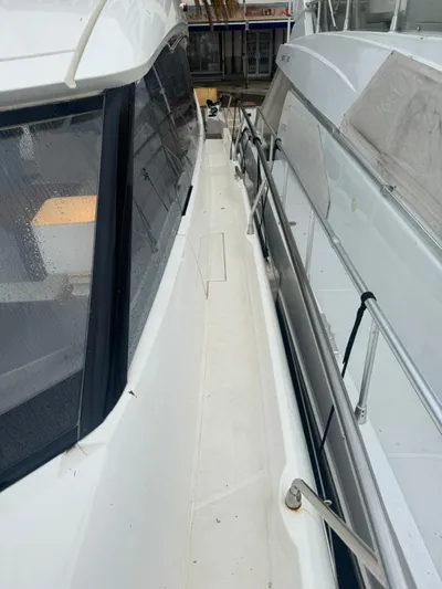  Yacht Photos Pics Side view of a 2011 Prestige 500 S yacht, showcasing sleek design and railing details.