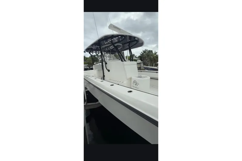  Yacht Photos Pics 2020 Contender 39 ST boat with sleek design, docked under cloudy skies.