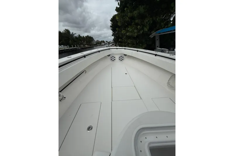  Yacht Photos Pics 2020 Contender 39 ST boat interior with sleek white deck and storage compartments.